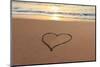 Heart in the Sand on the Beach at Sunset.-Hannamariah-Mounted Photographic Print