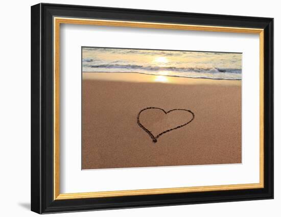 Heart in the Sand on the Beach at Sunset.-Hannamariah-Framed Photographic Print