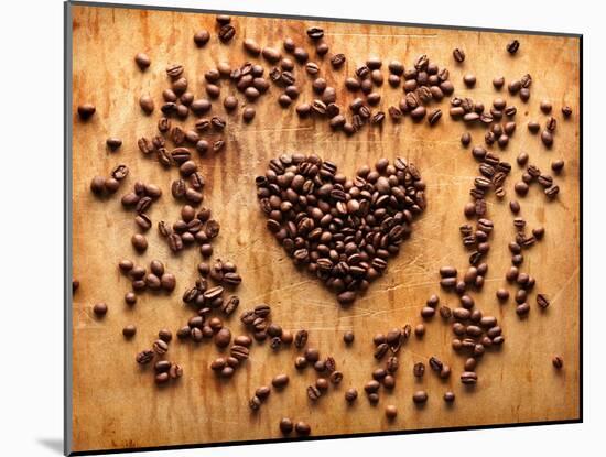 Heart Shape From Brown Coffee Beans, Close-Up On Old Vintage Wooden Background-ouh_desire-Mounted Art Print