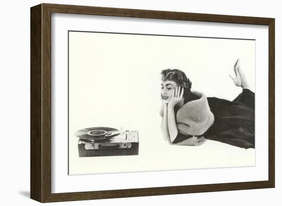 Heavily Browed Lady Listening to Record Player-null-Framed Premium Giclee Print