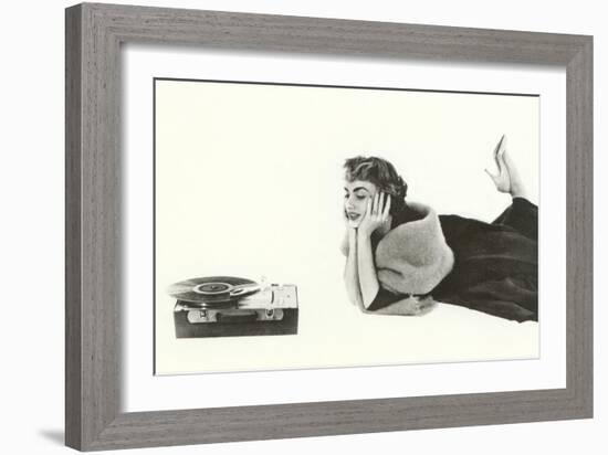 Heavily Browed Lady Listening to Record Player-null-Framed Art Print