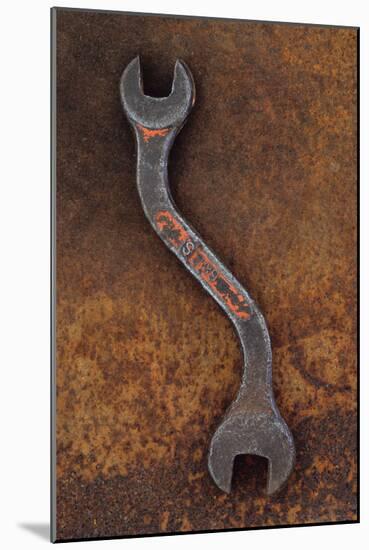 Heavy Double-headed Spanner with Bend in Handle Lying On Rusty Metal Sheet-Den Reader-Mounted Photographic Print