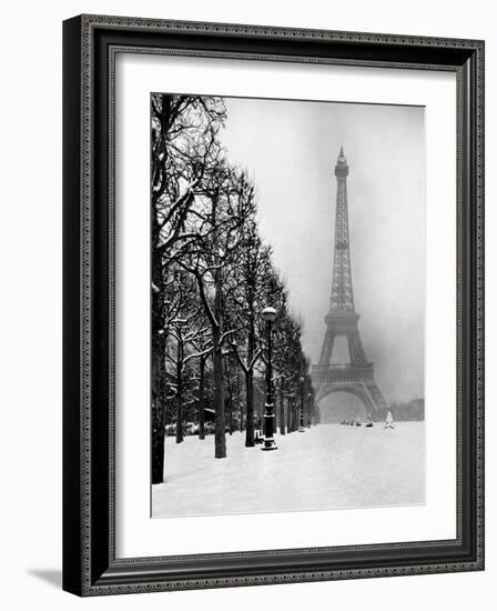 Heavy Snow Blankets the Ground Near the Eiffel Tower-Dmitri Kessel-Framed Photographic Print