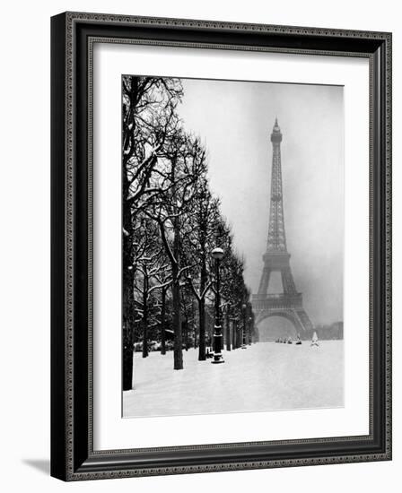 Heavy Snow Covers the Ground Near the Eiffel Tower-Dmitri Kessel-Framed Photographic Print