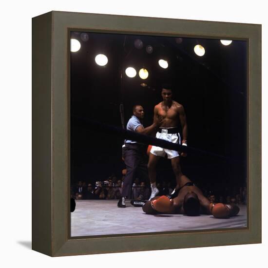 Heavyweight Boxer Cassius Clay, aka Muhammad Ali, Standing over Opponent Sonny Liston-George Silk-Framed Premier Image Canvas