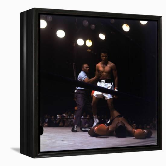 Heavyweight Boxer Cassius Clay, aka Muhammad Ali, Standing over Opponent Sonny Liston-George Silk-Framed Premier Image Canvas