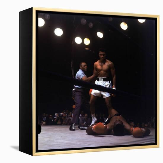 Heavyweight Boxer Cassius Clay, aka Muhammad Ali, Standing over Opponent Sonny Liston-George Silk-Framed Premier Image Canvas