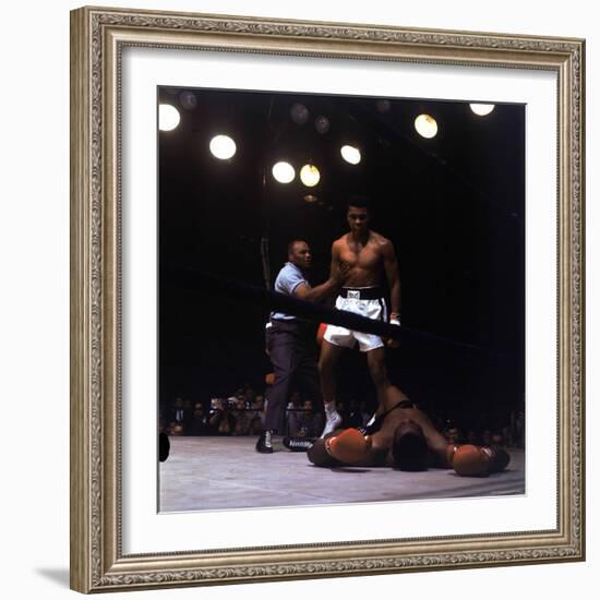 Heavyweight Boxer Cassius Clay, aka Muhammad Ali, Standing over Opponent Sonny Liston-George Silk-Framed Premium Photographic Print