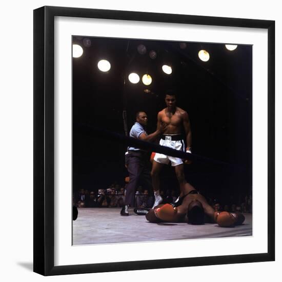 Heavyweight Boxer Cassius Clay, aka Muhammad Ali, Standing over Opponent Sonny Liston-George Silk-Framed Premium Photographic Print