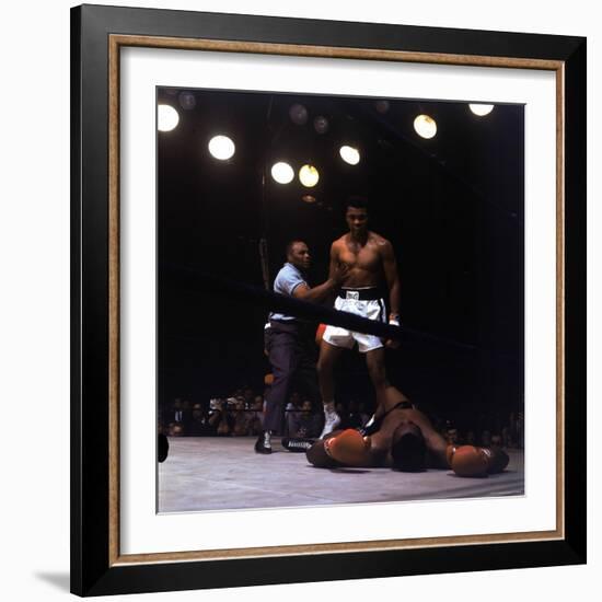 Heavyweight Boxer Cassius Clay, aka Muhammad Ali, Standing over Opponent Sonny Liston-George Silk-Framed Premium Photographic Print