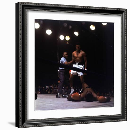 Heavyweight Boxer Cassius Clay, aka Muhammad Ali, Standing over Opponent Sonny Liston-George Silk-Framed Premium Photographic Print