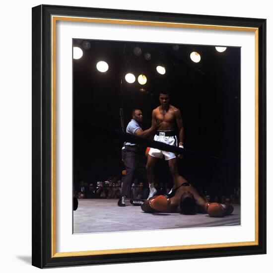 Heavyweight Boxer Cassius Clay, aka Muhammad Ali, Standing over Opponent Sonny Liston-George Silk-Framed Premium Photographic Print