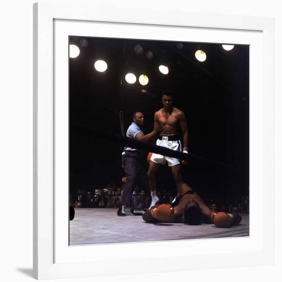 Heavyweight Boxer Cassius Clay, aka Muhammad Ali, Standing over Opponent Sonny Liston-George Silk-Framed Premium Photographic Print