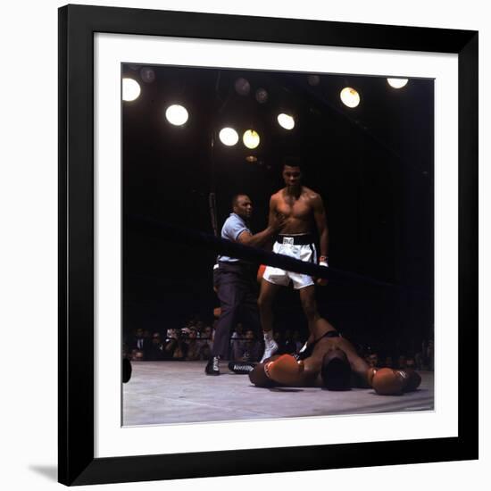 Heavyweight Boxer Cassius Clay, aka Muhammad Ali, Standing over Opponent Sonny Liston-George Silk-Framed Premium Photographic Print