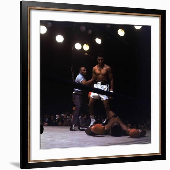 Heavyweight Boxer Cassius Clay, aka Muhammad Ali, Standing over Opponent Sonny Liston-George Silk-Framed Premium Photographic Print