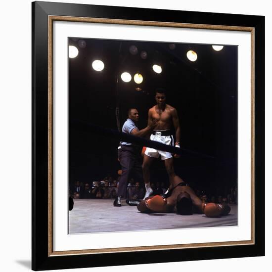 Heavyweight Boxer Cassius Clay, aka Muhammad Ali, Standing over Opponent Sonny Liston-George Silk-Framed Premium Photographic Print