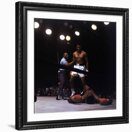 Heavyweight Boxer Cassius Clay, aka Muhammad Ali, Standing over Opponent Sonny Liston-George Silk-Framed Premium Photographic Print