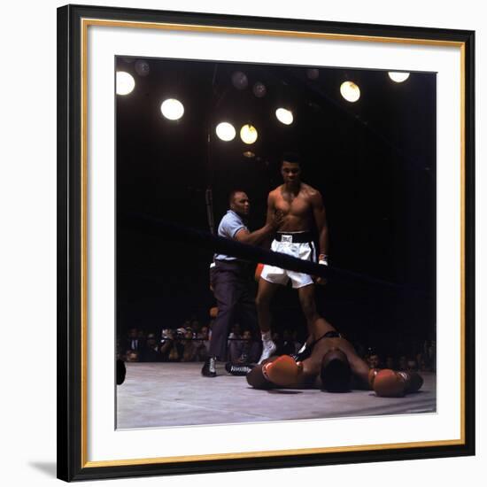 Heavyweight Boxer Cassius Clay, aka Muhammad Ali, Standing over Opponent Sonny Liston-George Silk-Framed Premium Photographic Print