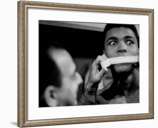 Heavyweight Contender Cassius Clay, Getting His Mouth Taped by Trainer Angelo Dundee-George Silk-Framed Premium Photographic Print