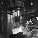 Two Factory Workers Pour Molten Metal into a Small Mould. Photograph by Heinz Zinram-Heinz Zinram-Photographic Print