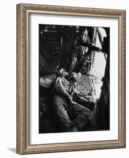 Helicopter Chief James C. Farley Working Jammed Machine as Pilot Lt. James Magel Dying Beside Him-Larry Burrows-Framed Photographic Print