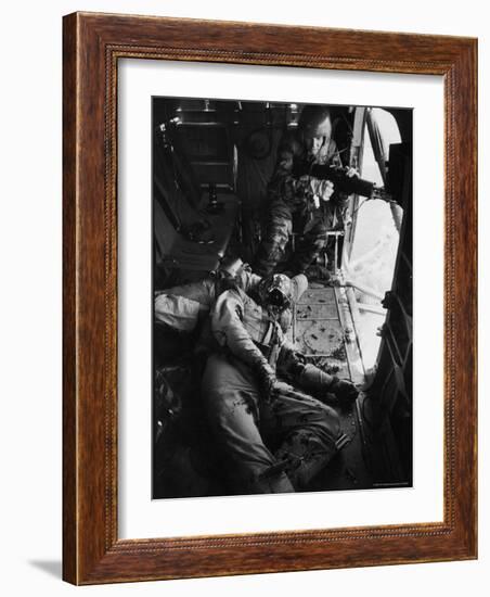 Helicopter Chief James C. Farley Working Jammed Machine as Pilot Lt. James Magel Dying Beside Him-Larry Burrows-Framed Photographic Print