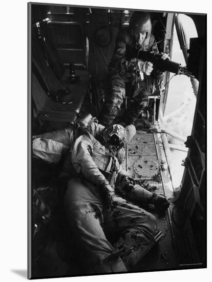 Helicopter Chief James C. Farley Working Jammed Machine as Pilot Lt. James Magel Dying Beside Him-Larry Burrows-Mounted Photographic Print
