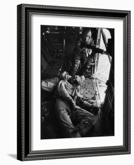 Helicopter Chief James C. Farley Working Jammed Machine as Pilot Lt. James Magel Dying Beside Him-Larry Burrows-Framed Photographic Print