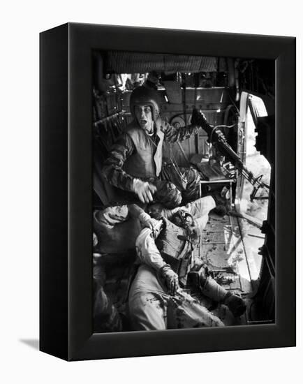 Helicopter Crew Chief James C. Farley Shouting to Crew as Wounded Comrades Lay Dying at His Feet-Larry Burrows-Framed Premier Image Canvas