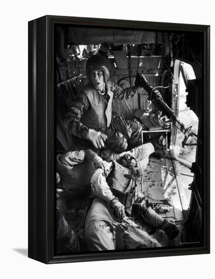 Helicopter Crew Chief James C. Farley Shouting to Crew as Wounded Comrades Lay Dying at His Feet-Larry Burrows-Framed Premier Image Canvas