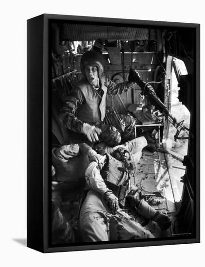 Helicopter Crew Chief James C. Farley Shouting to Crew as Wounded Comrades Lay Dying at His Feet-Larry Burrows-Framed Premier Image Canvas