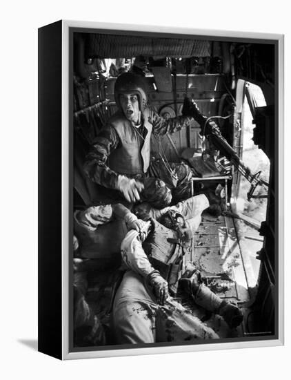 Helicopter Crew Chief James C. Farley Shouting to Crew as Wounded Comrades Lay Dying at His Feet-Larry Burrows-Framed Premier Image Canvas