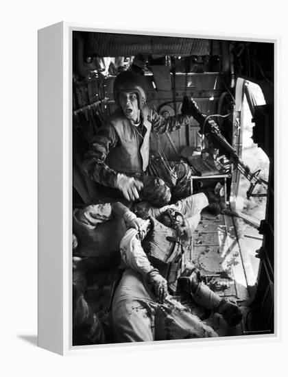 Helicopter Crew Chief James C. Farley Shouting to Crew as Wounded Comrades Lay Dying at His Feet-Larry Burrows-Framed Premier Image Canvas