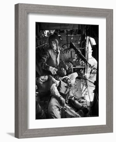 Helicopter Crew Chief James C. Farley Shouting to Crew as Wounded Comrades Lay Dying at His Feet-Larry Burrows-Framed Photographic Print