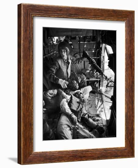 Helicopter Crew Chief James C. Farley Shouting to Crew as Wounded Comrades Lay Dying at His Feet-Larry Burrows-Framed Photographic Print