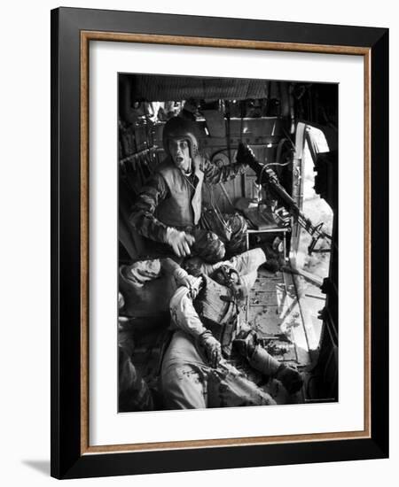 Helicopter Crew Chief James C. Farley Shouting to Crew as Wounded Comrades Lay Dying at His Feet-Larry Burrows-Framed Photographic Print