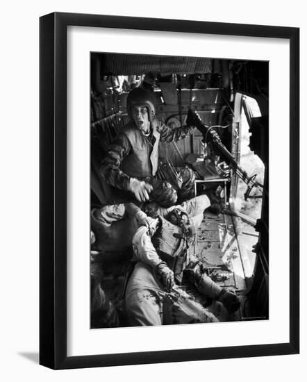 Helicopter Crew Chief James C. Farley Shouting to Crew as Wounded Comrades Lay Dying at His Feet-Larry Burrows-Framed Photographic Print