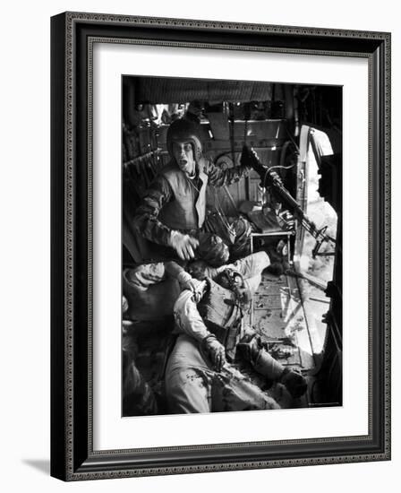 Helicopter Crew Chief James C. Farley Shouting to Crew as Wounded Comrades Lay Dying at His Feet-Larry Burrows-Framed Photographic Print