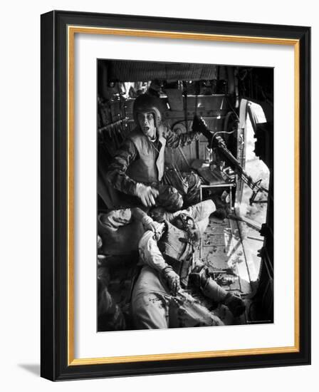 Helicopter Crew Chief James C. Farley Shouting to Crew as Wounded Comrades Lay Dying at His Feet-Larry Burrows-Framed Photographic Print