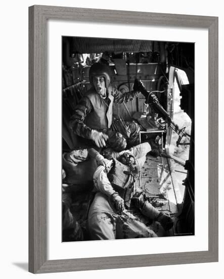 Helicopter Crew Chief James C. Farley Shouting to Crew as Wounded Comrades Lay Dying at His Feet-Larry Burrows-Framed Photographic Print