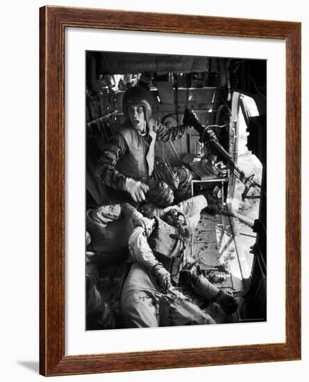 Helicopter Crew Chief James C. Farley Shouting to Crew as Wounded Comrades Lay Dying at His Feet-Larry Burrows-Framed Photographic Print