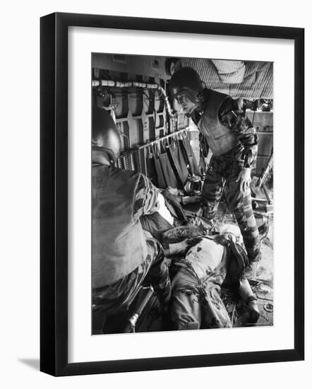 Helicopter Crew Chief James C. Farley with Wounded Pilot Lt. James Magel Lays Dying at His Feet-Larry Burrows-Framed Photographic Print