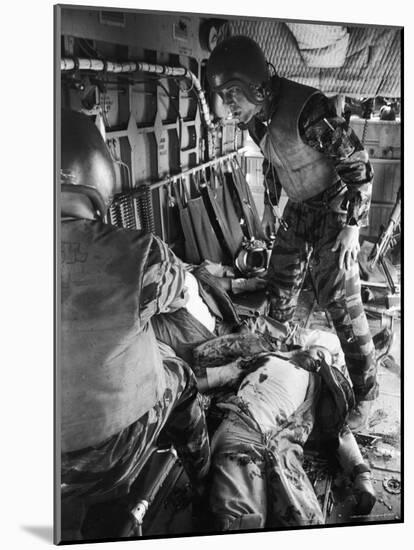 Helicopter Crew Chief James C. Farley with Wounded Pilot Lt. James Magel Lays Dying at His Feet-Larry Burrows-Mounted Photographic Print