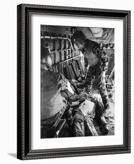Helicopter Crew Chief James C. Farley with Wounded Pilot Lt. James Magel Lays Dying at His Feet-Larry Burrows-Framed Photographic Print