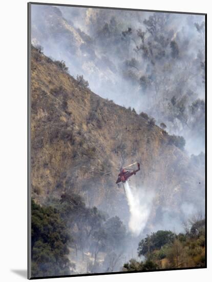 Helicopter Makes a Water Drop as Firefighters Battle a Wildfire in the San Gabriel Mountains-null-Mounted Photographic Print