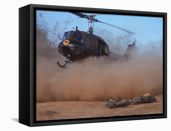 Helicopter Touching Down to Retrieve Bodies of Soldiers Killed in Firefight During the Vietnam War-Larry Burrows-Framed Premier Image Canvas