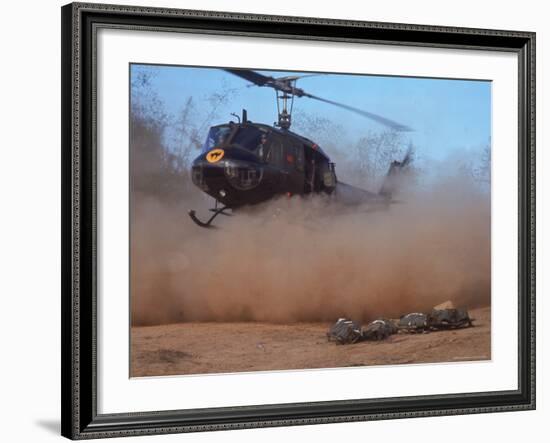 Helicopter Touching Down to Retrieve Bodies of Soldiers Killed in Firefight During the Vietnam War-Larry Burrows-Framed Photographic Print