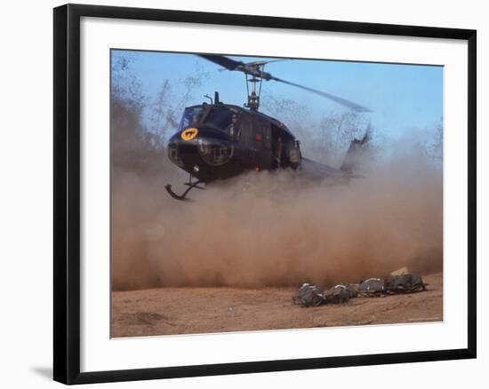 Helicopter Touching Down to Retrieve Bodies of Soldiers Killed in Firefight During the Vietnam War-Larry Burrows-Framed Photographic Print