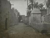 Voyage en Algérie : Femme marchant dans une rue à Biskra-Henri Jacques Edouard Evenepoel-Framed Premier Image Canvas