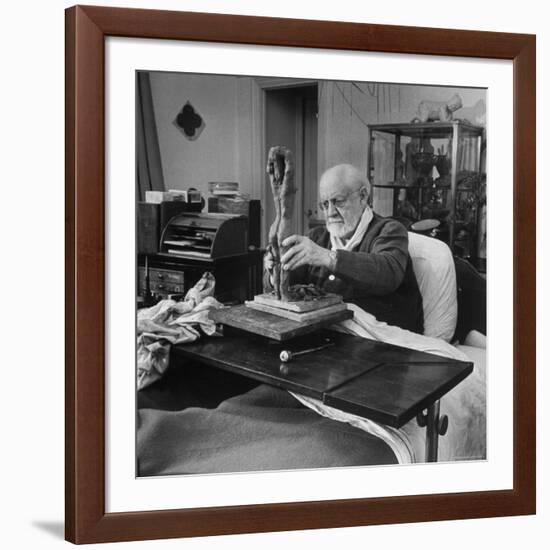 Henri Matisse Sculpting Nude Female Figure While Sitting in Bed in His Apartment-Dmitri Kessel-Framed Premium Photographic Print